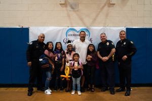 Phoenix Students, Police and Kevin Rowe | Backpack Giveaway