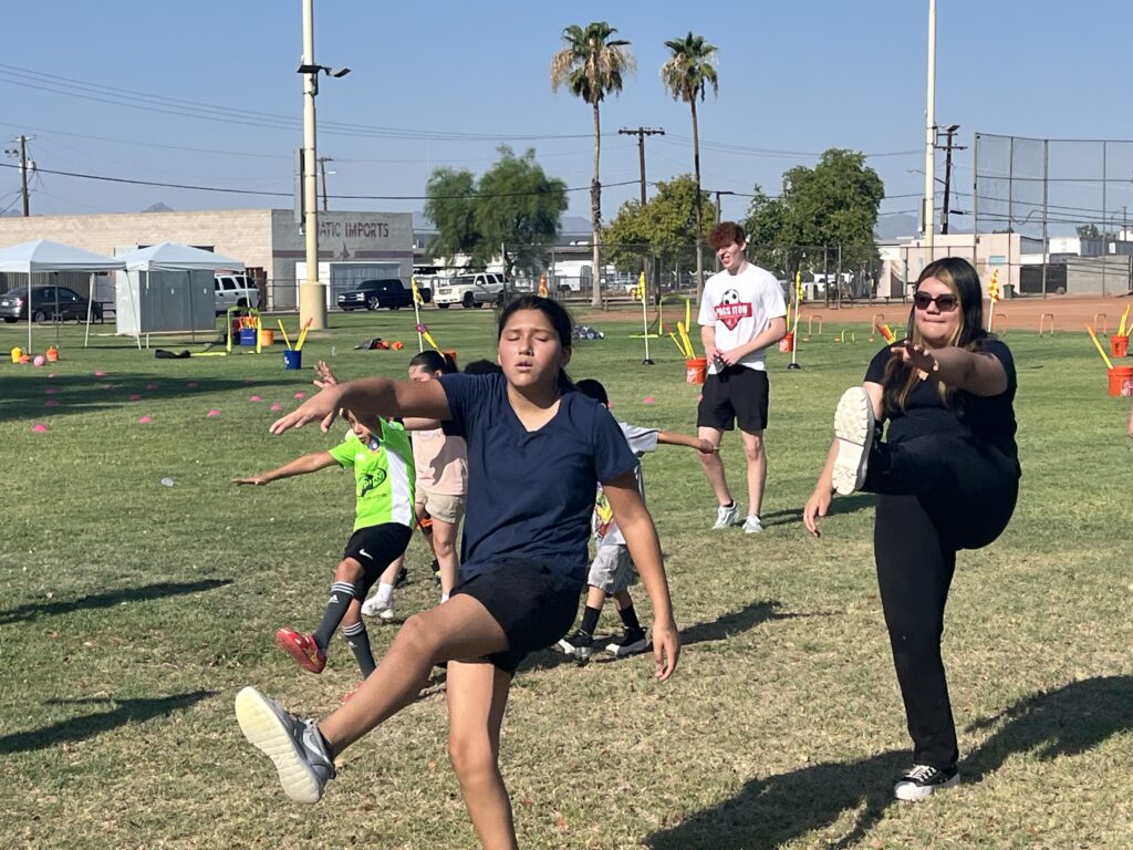 Youth at Pass it On soccer clinic 