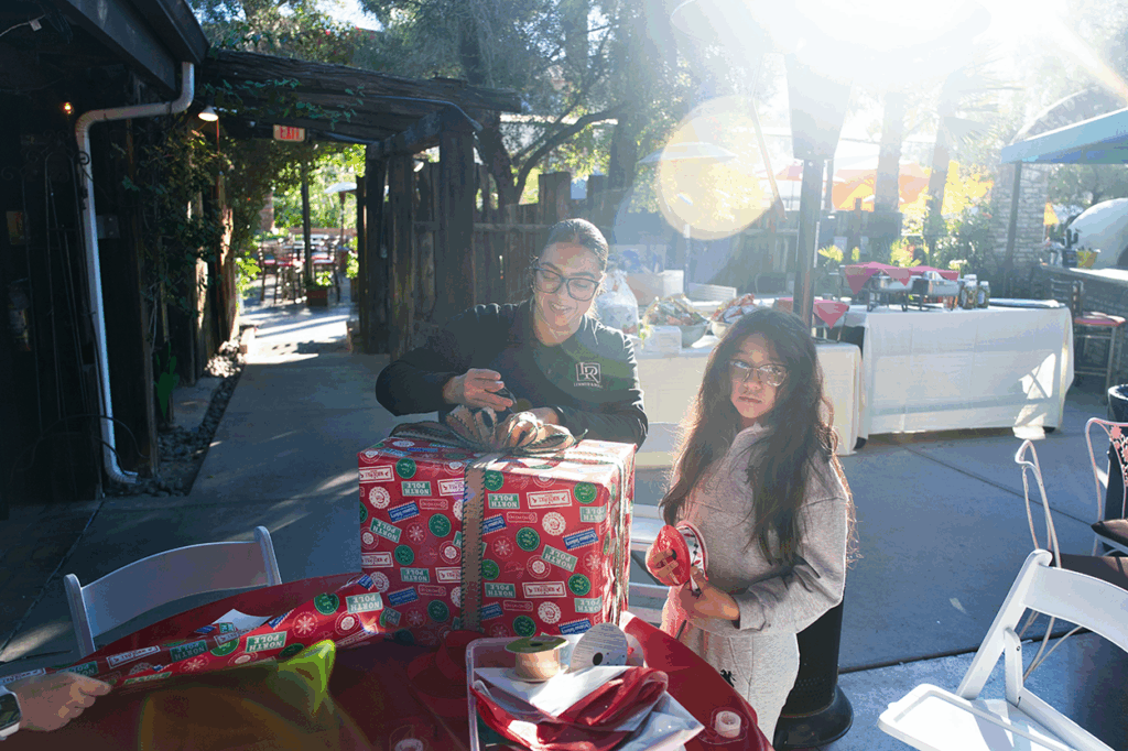 Gift wrapping McKenna Youth Foundation's Annual Children's Holiday Party 2025