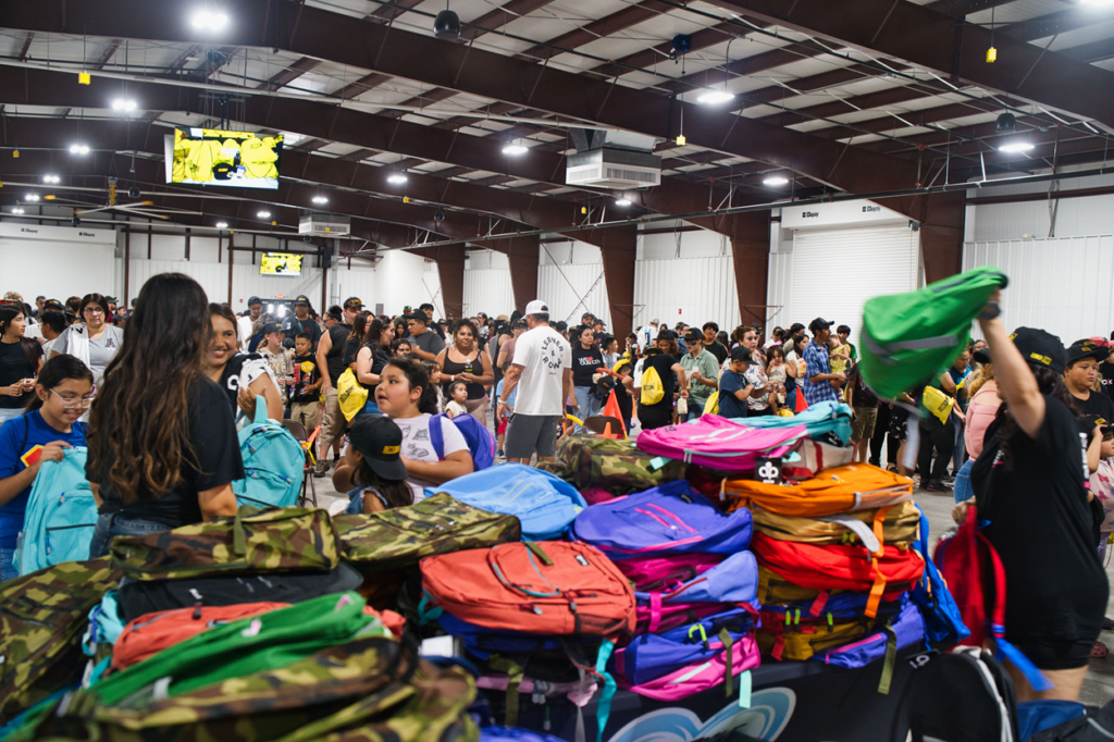 Happy crowd at Yuma backpack giveaway 2026
